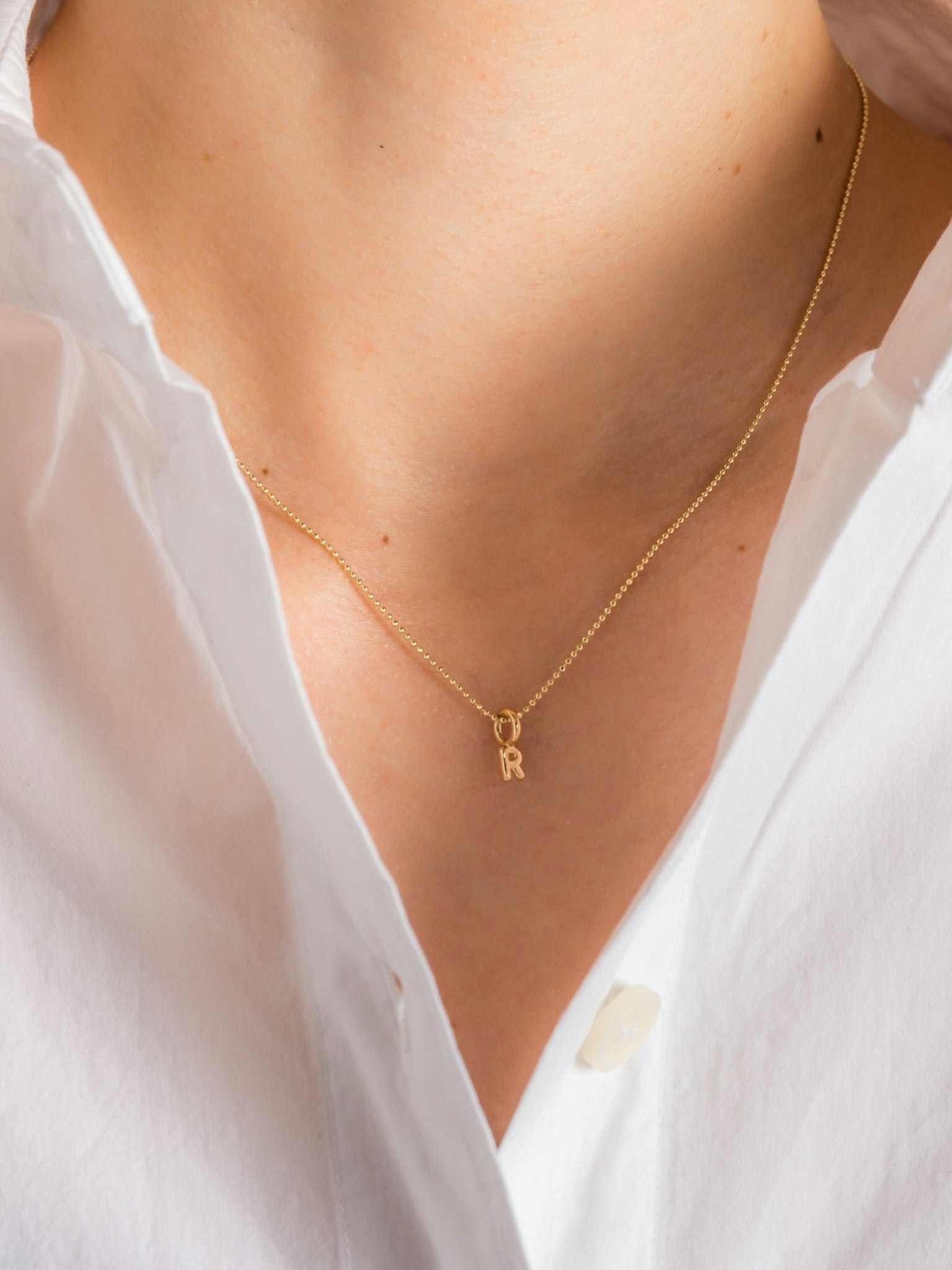 Mini helium initial charm necklace photo 10