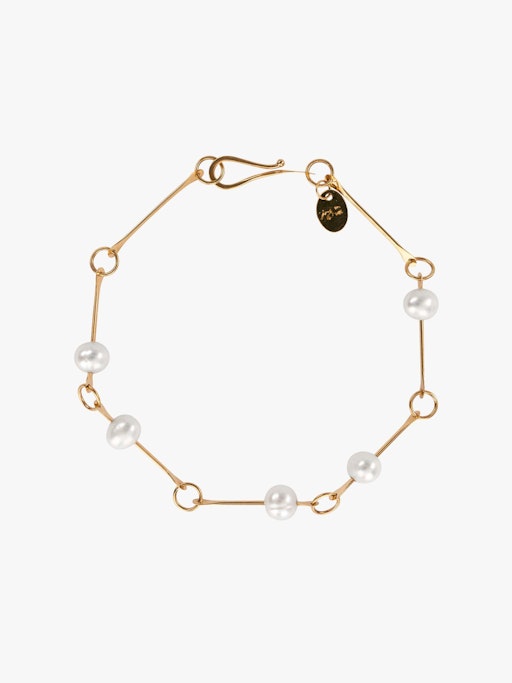 Bone chain bracelet with floating pearls photo