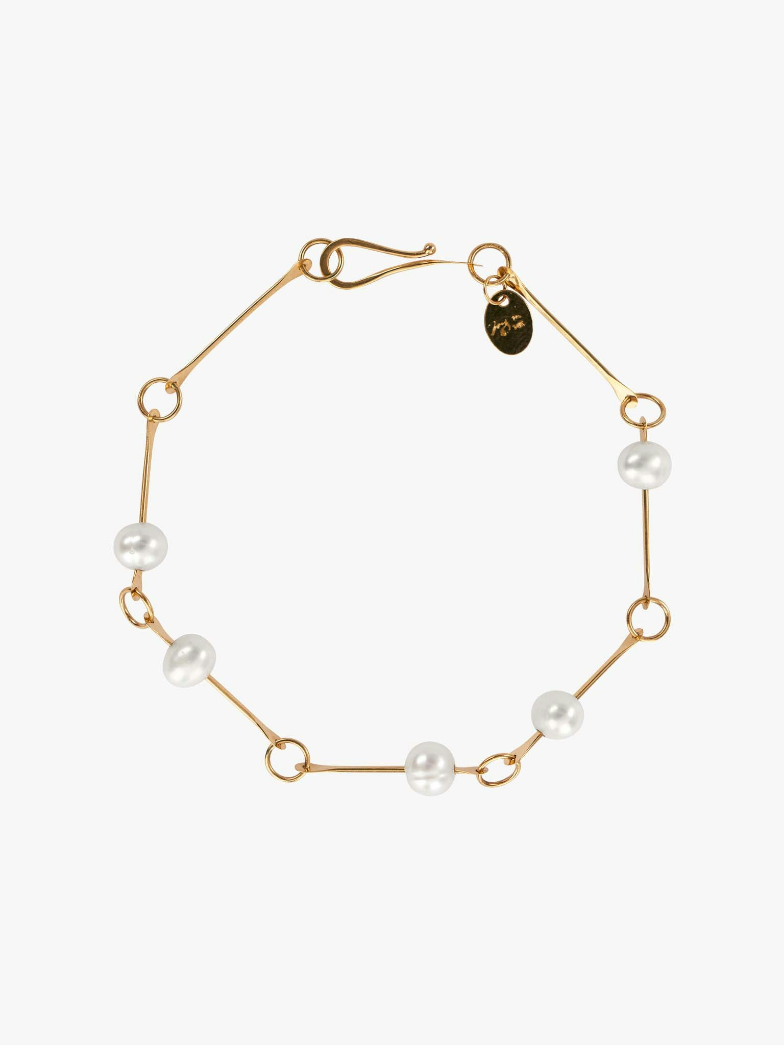 Bone chain bracelet with floating pearls photo 1